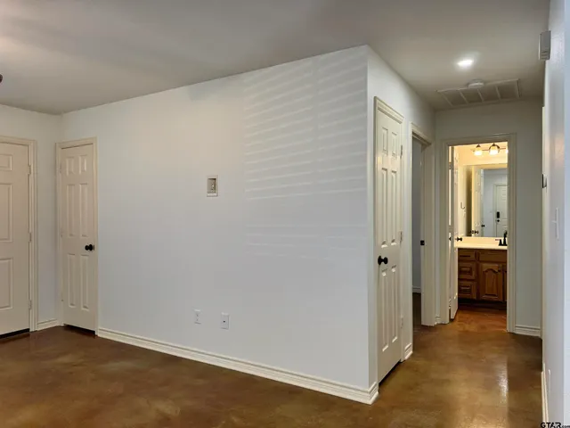 a view of a hallway with closet