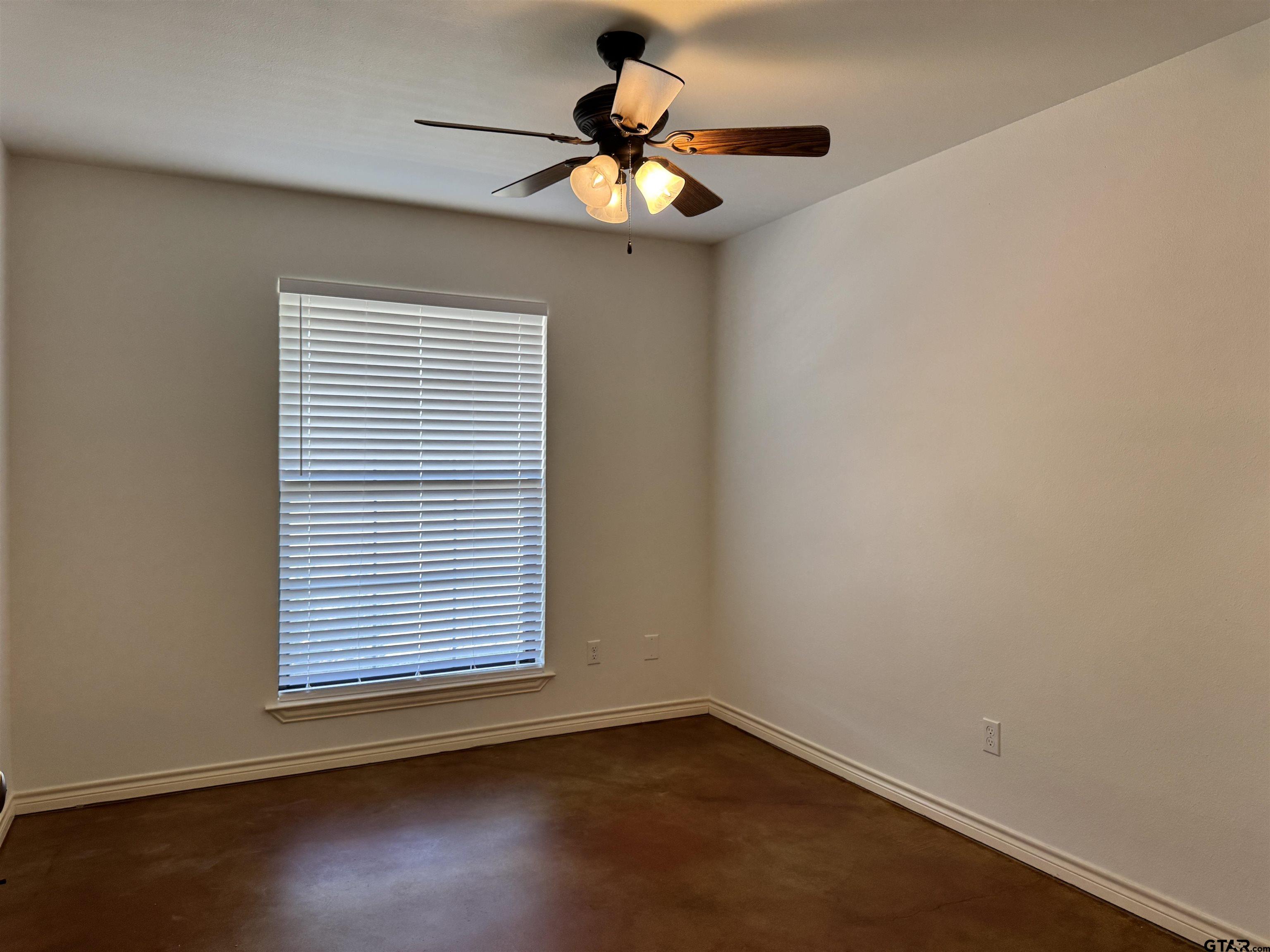 13343 Country Meadow Lane Lindale, TX 75771 - Photo 15 of 20 a view of an empty room with wooden floor and a window