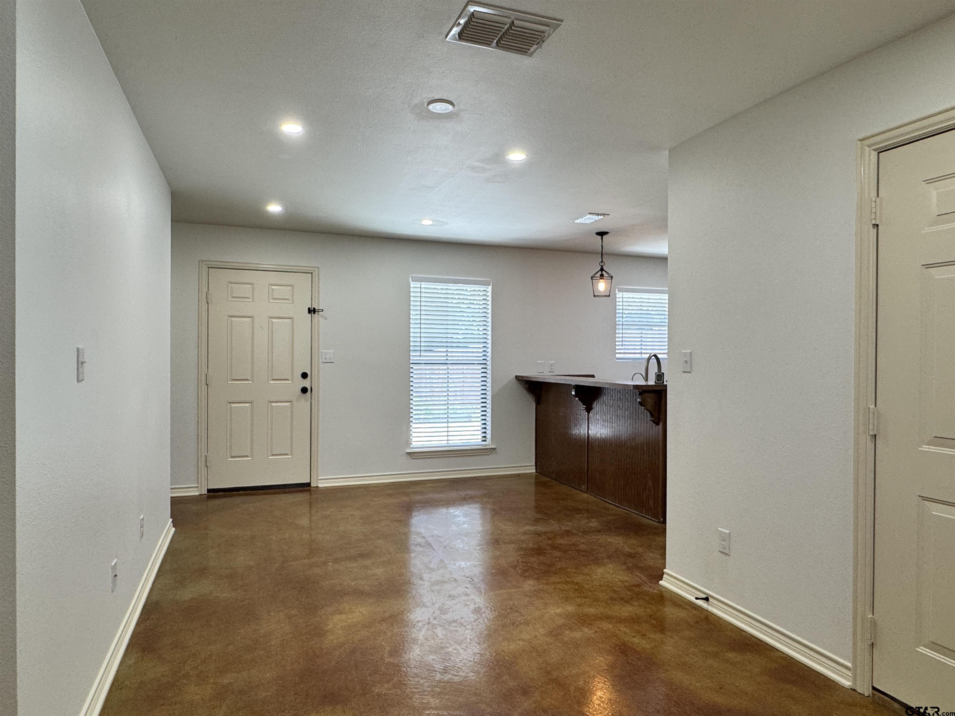 13343 Country Meadow Lane Lindale, TX 75771 - Photo 3 of 20 an empty room with wooden floor and windows
