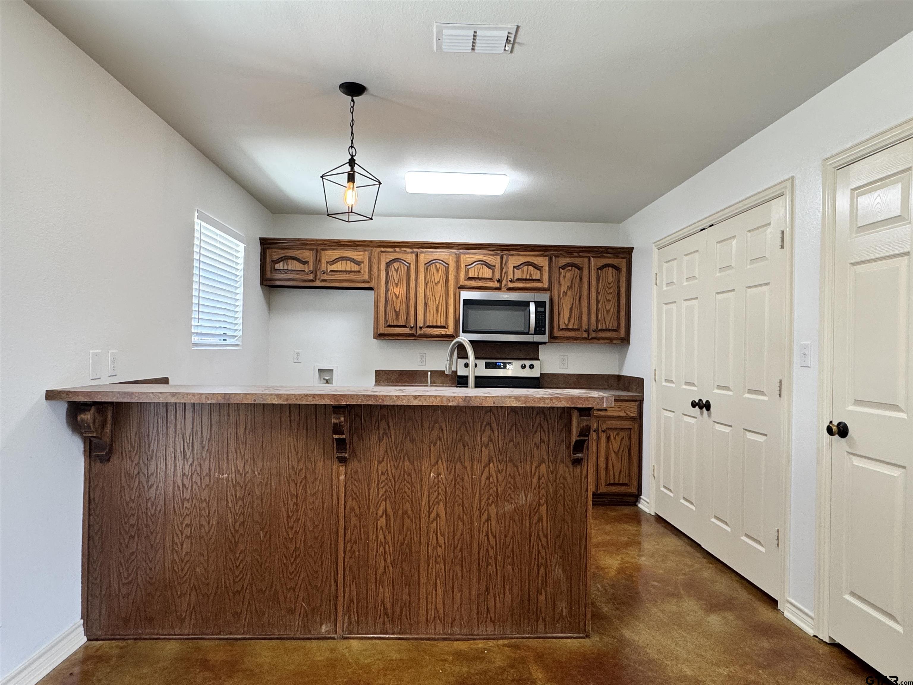13343 Country Meadow Lane Lindale, TX 75771 - Photo 5 of 20 a view of cabinets and wooden floor