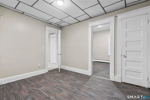 an empty room with wooden floor