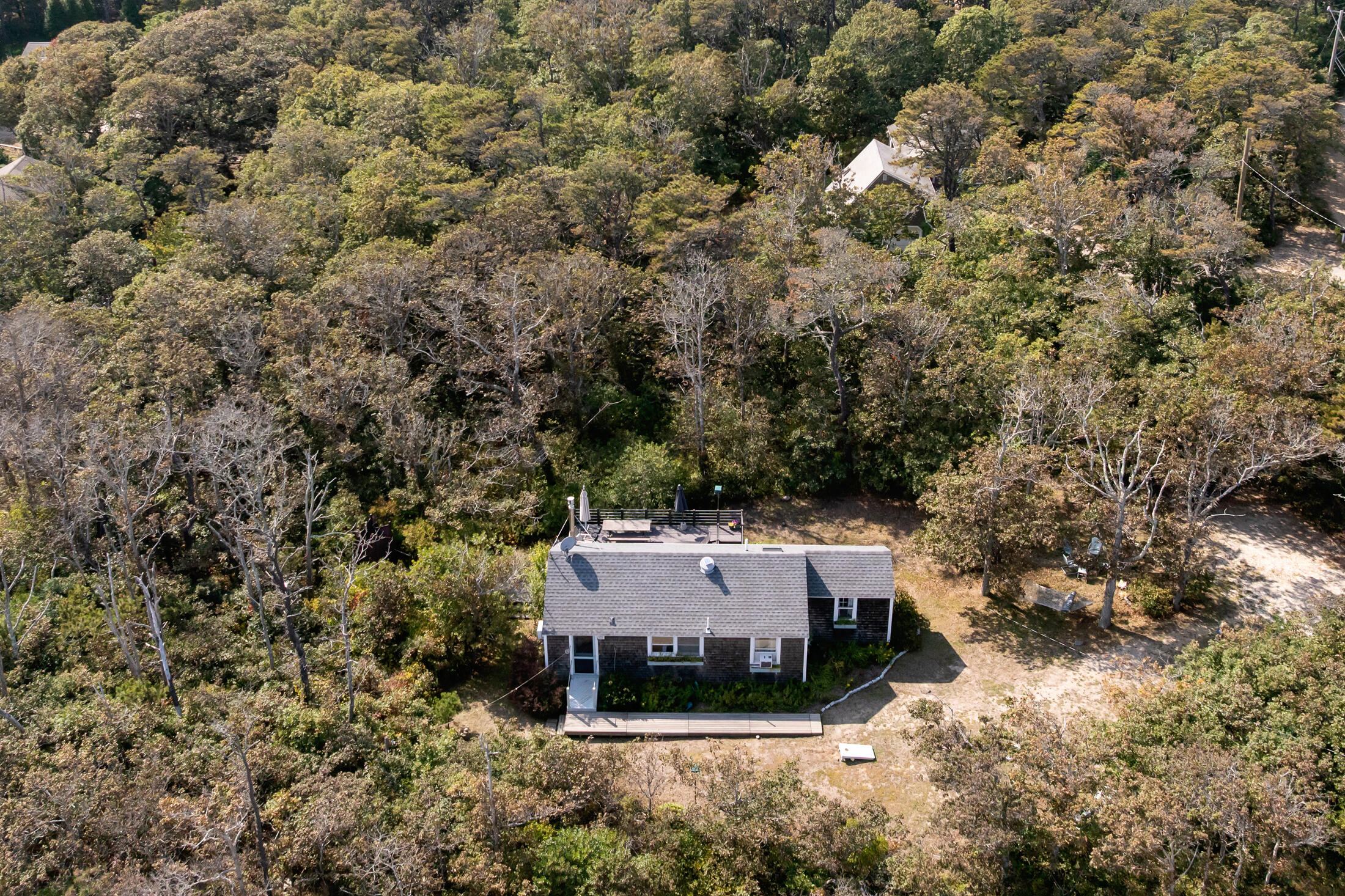 135 Nauset Light Beach Road Eastham, MA 02642 - Photo 29 of 34 an aerial view of a house with yard and outdoor seating