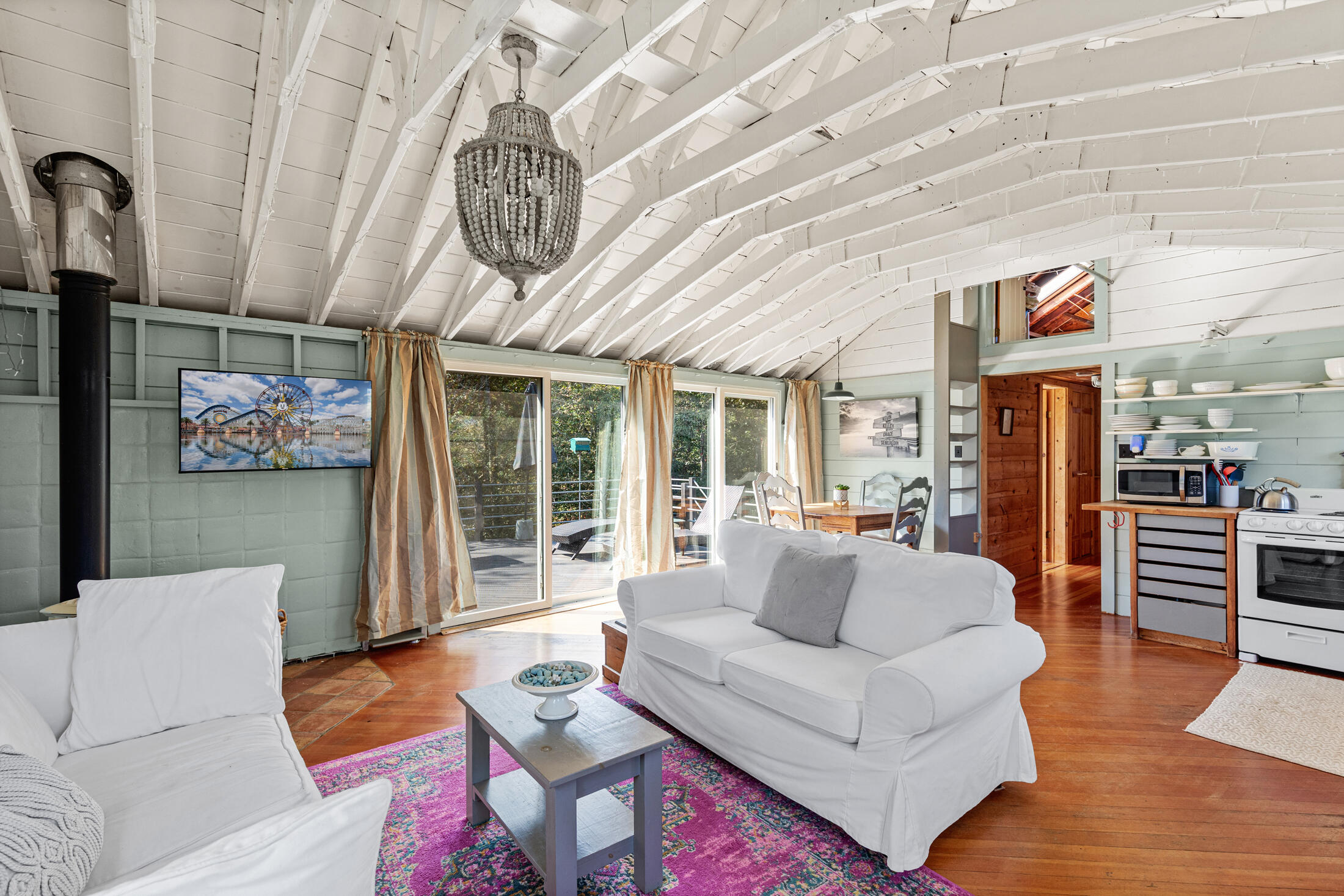 135 Nauset Light Beach Road Eastham, MA 02642 - Photo 9 of 34 a living room with furniture a couch and large window