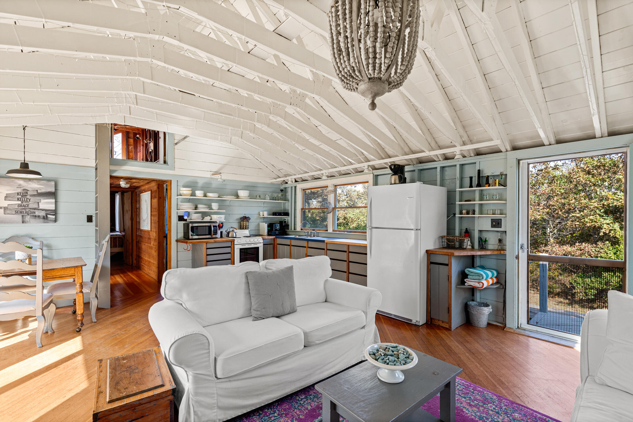 135 Nauset Light Beach Road Eastham, MA 02642 - Photo 10 of 34 a living room with furniture and a window