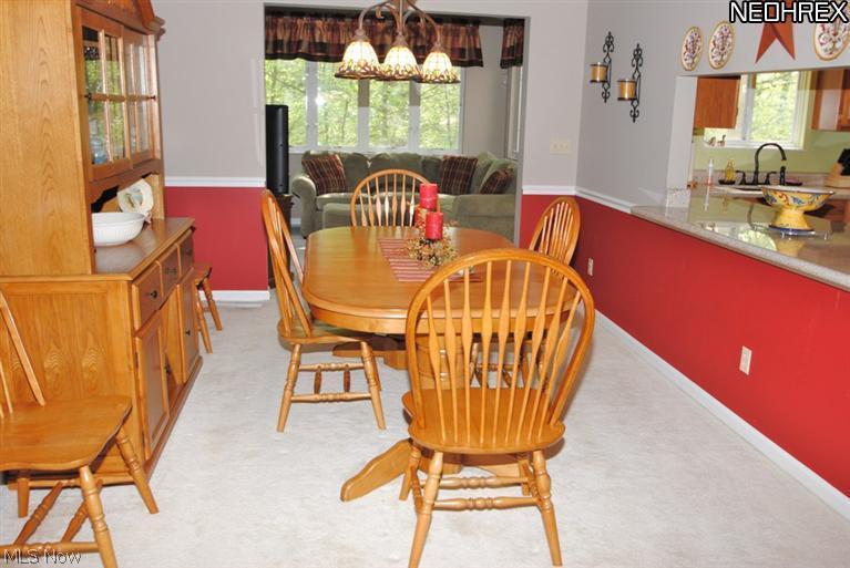 675 Briar Ridge Lane Akron, OH 44313 - Photo 5 of 20 The opening between the dining room and kitchen is perfect for serving.