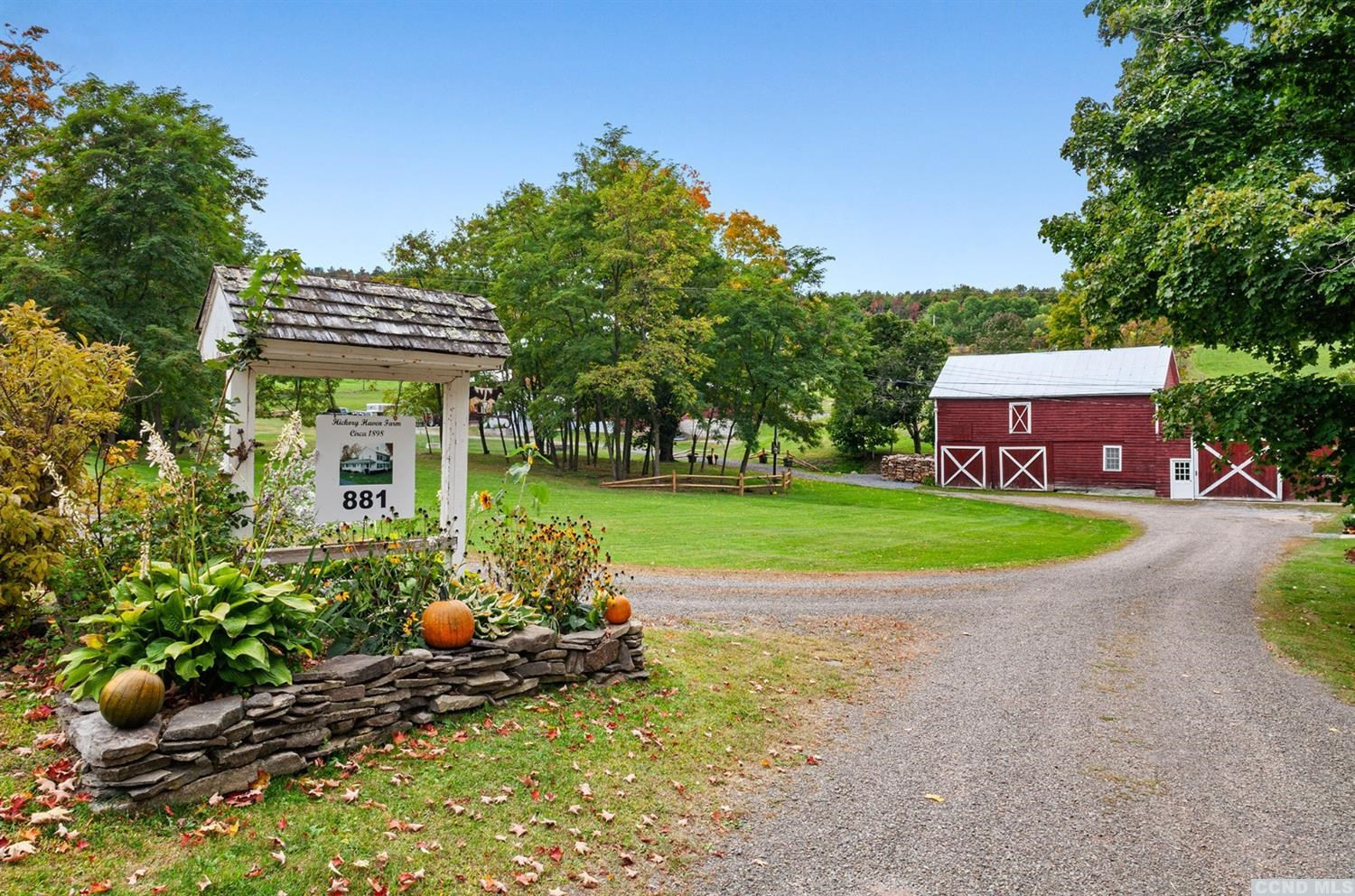 881 Guinea Road Middleburgh, NY 12122 - Photo 2 of 21 a view of a house with a yard and sitting area