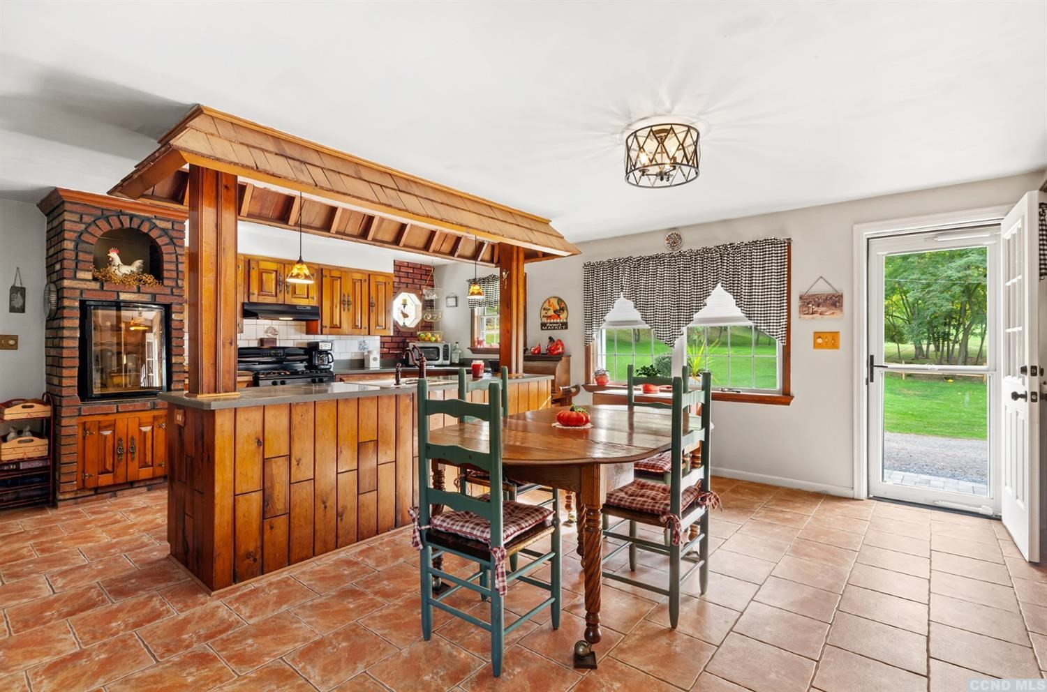 881 Guinea Road Middleburgh, NY 12122 - Photo 4 of 21 a dining room with a lots of table and a large window