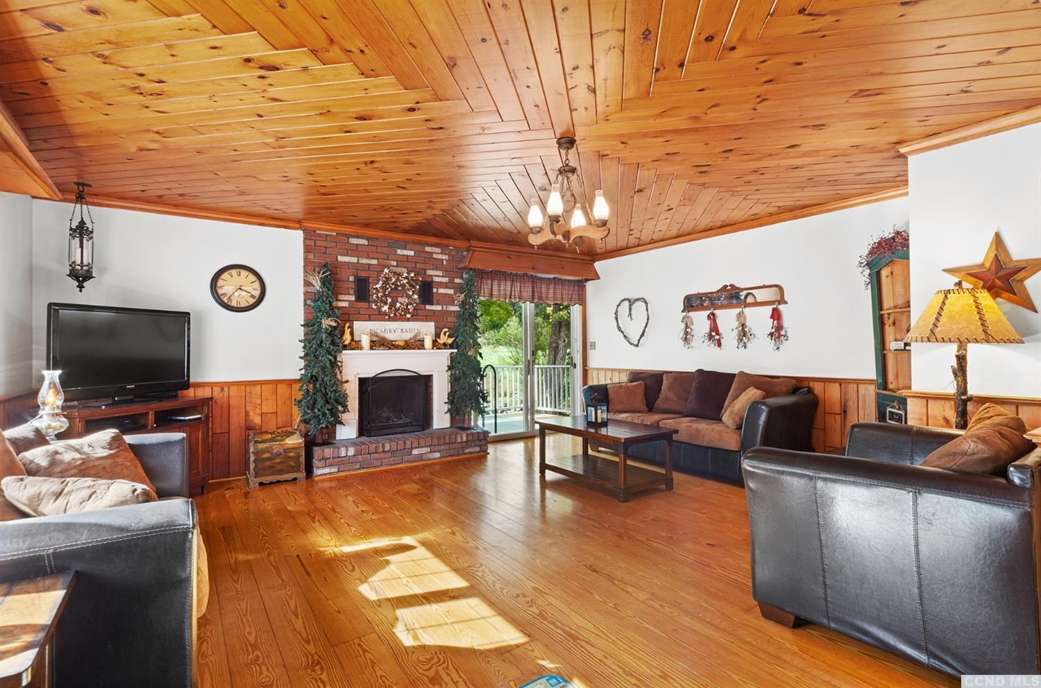 881 Guinea Road Middleburgh, NY 12122 - Photo 6 of 21 a living room with furniture and a flat screen tv