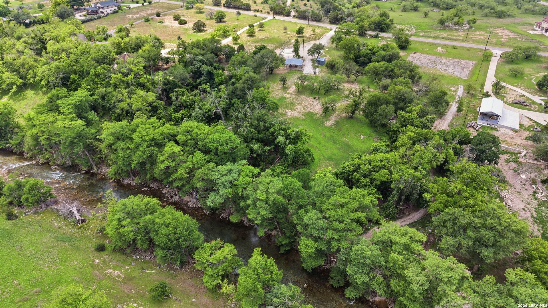 261 Fawn Lane Spring Branch, TX 78070 - Photo 37 of 44 an aerial view of residential house with outdoor space and trees all around