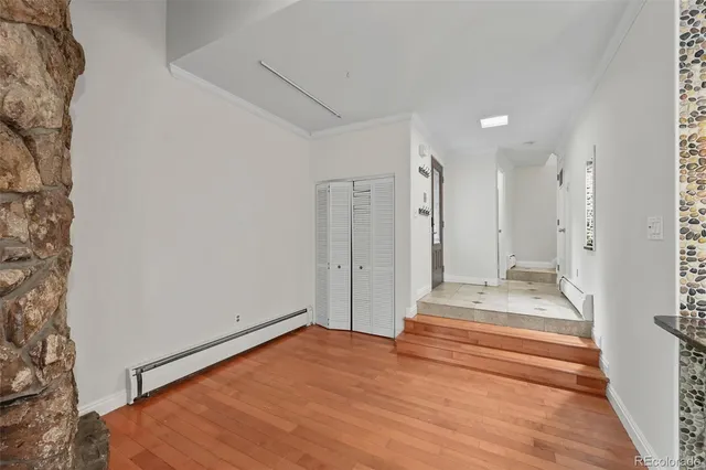a view of a closet area with living room