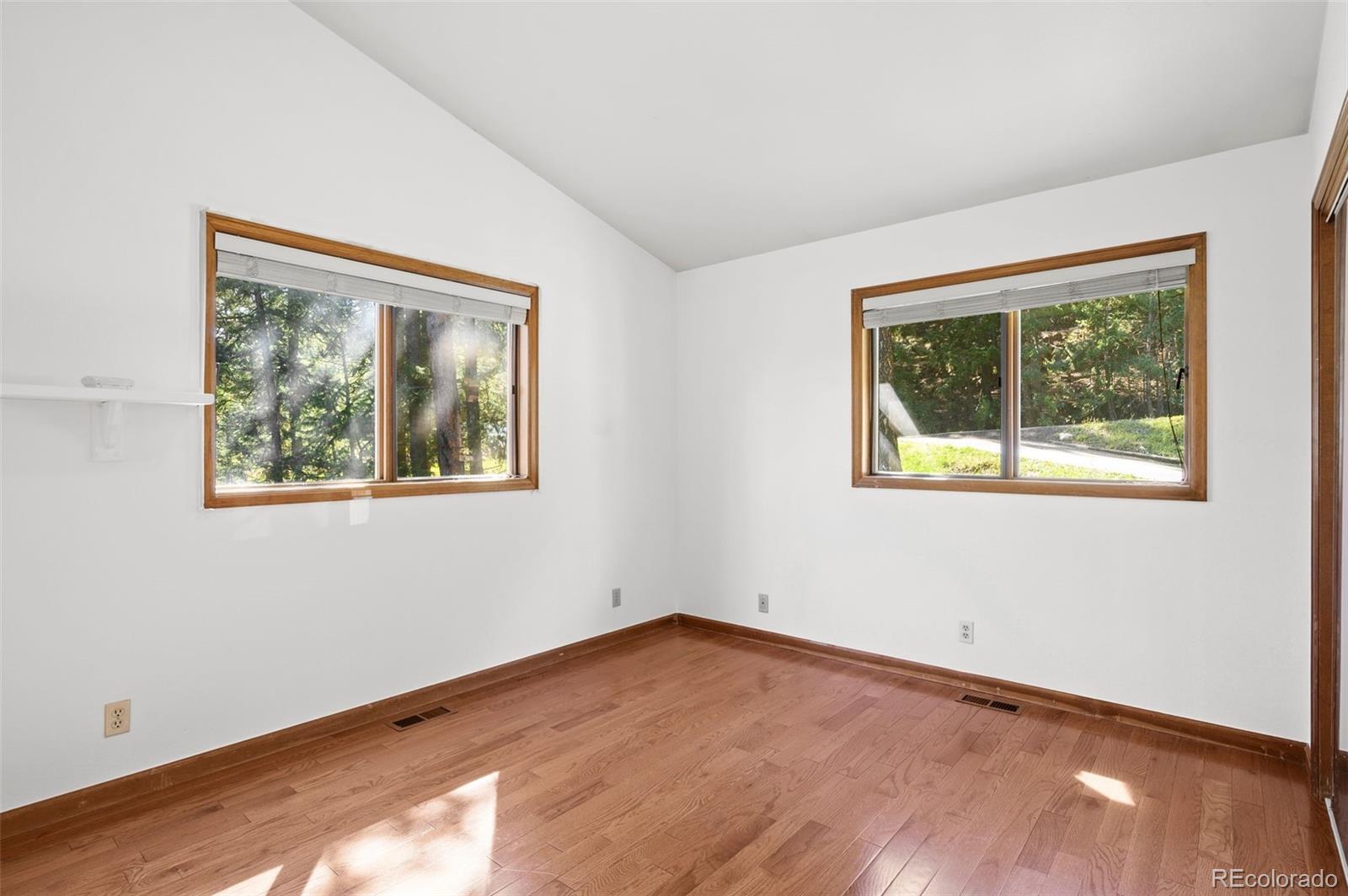 30243 Pine Crest Drive Evergreen, CO 80439 - Photo 18 of 36 a view of empty room with window