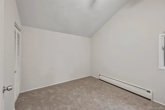 a view of a hallway with washer and dryer