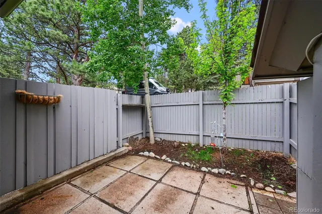 a view of a house with a door and wooden walls