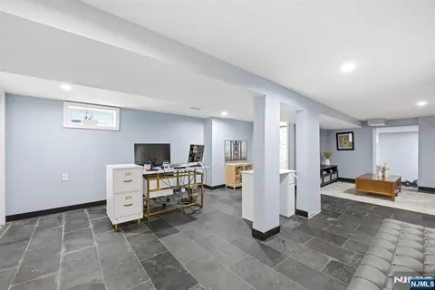a view of living room kitchen with furniture and flat screen tv