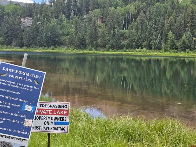 a view of a lake with a big yard