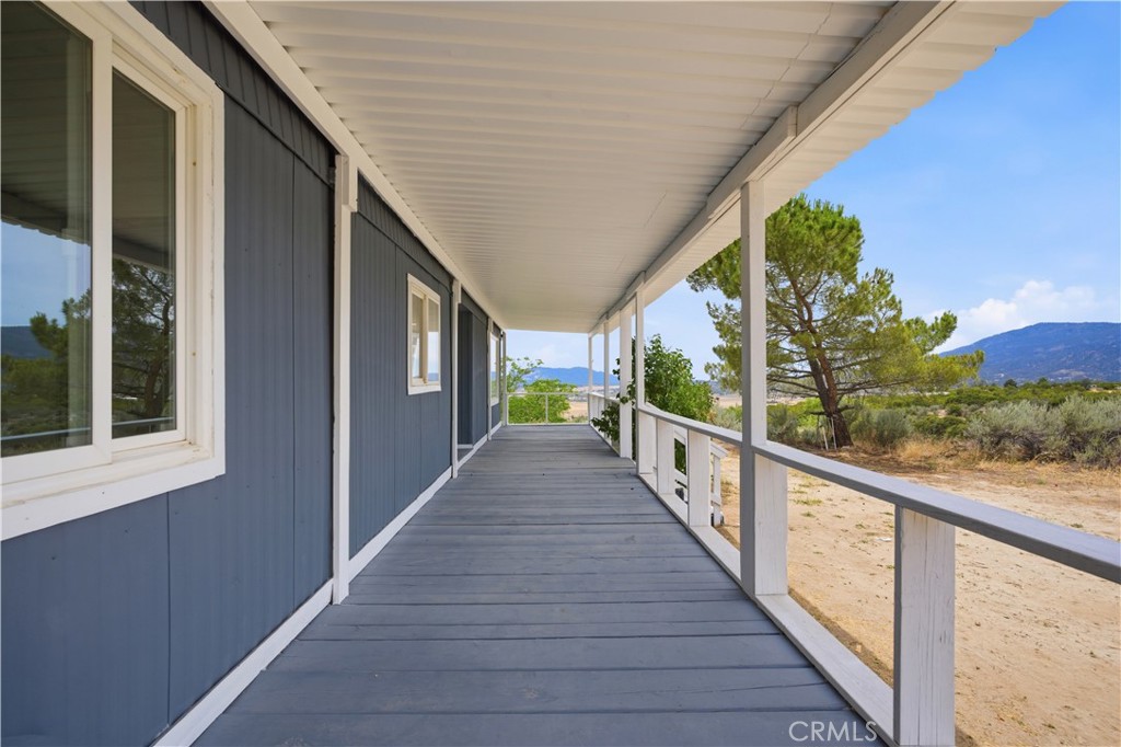 59995 Granite Gulley Road Anza, CA 92539 - Photo 5 of 33 a view of a balcony with wooden floor