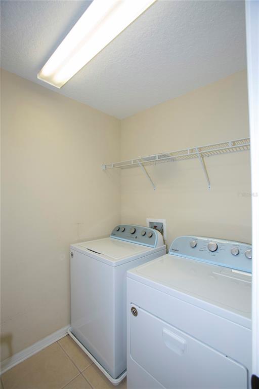 11919 Essington Street New Port Richey, FL 34654 - Photo 23 of 46 a utility room with dryer and washer