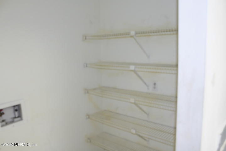 7895 Gulf Road South Jacksonville, FL 32244 - Photo 9 of 16 Pantry shelves inside of laundry room