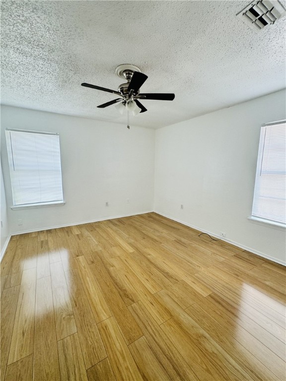 2119 Zephyr Ingleside, TX 78362 - Photo 8 of 9 a view of empty room with wooden floor and fan
