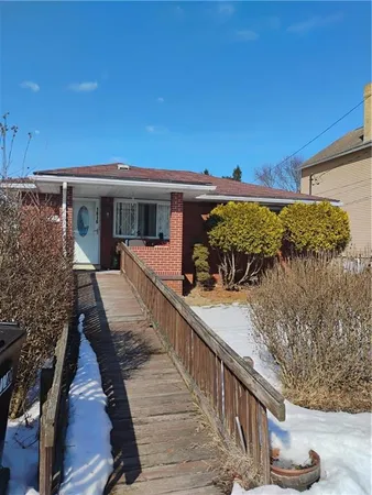 a view of a house with wooden deck