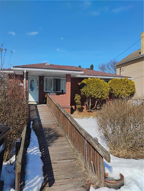 a view of a house with wooden deck