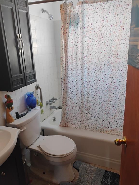 1816 Filmore Street Aliquippa, PA 15001 - Photo 13 of 17 a white toilet sitting next to a bath tub