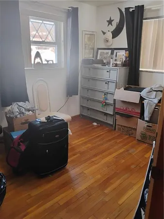 a room with furniture and a wooden floor