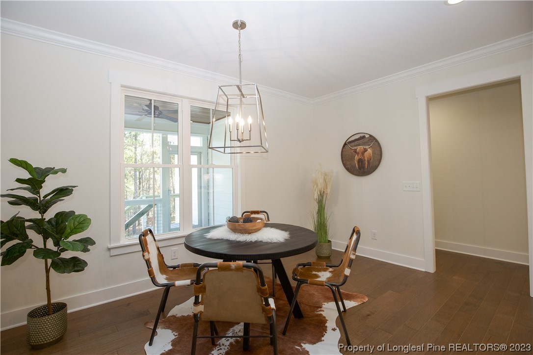 1365 McCaskill Road Carthage, NC 28327 - Photo 12 of 50 a view of a dining room with furniture window and wooden floor