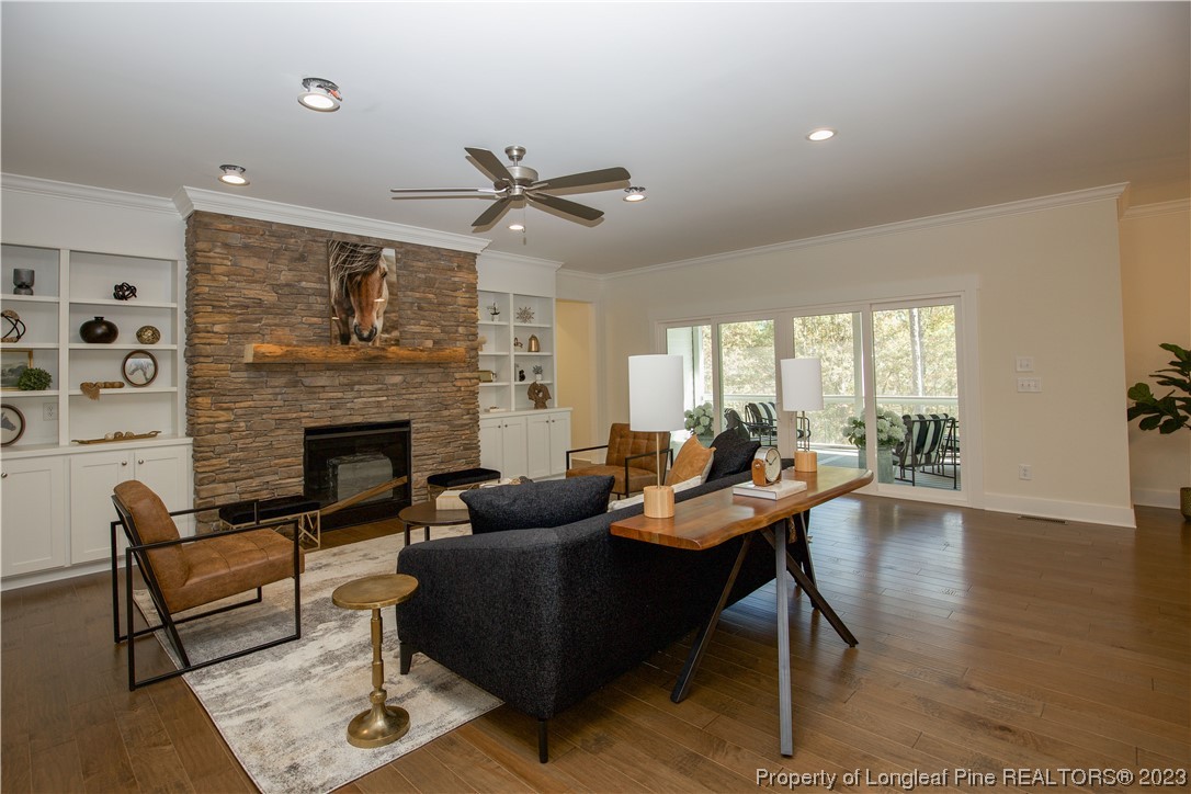 1365 McCaskill Road Carthage, NC 28327 - Photo 14 of 50 a living room with furniture a fireplace and a table