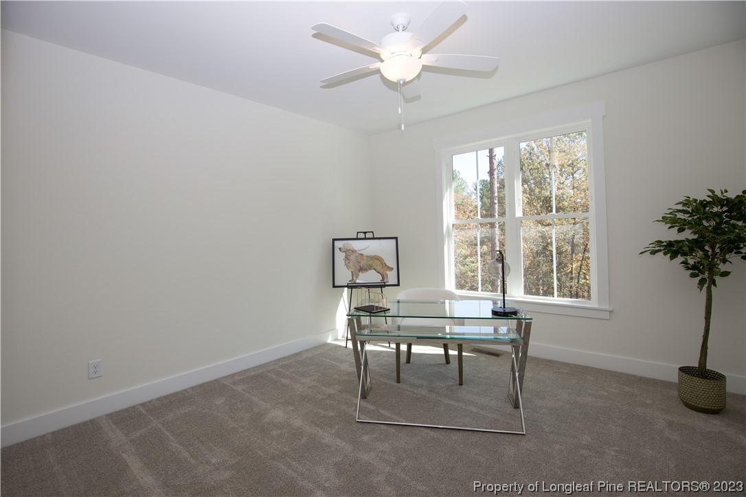 1365 McCaskill Road Carthage, NC 28327 - Photo 22 of 50 a workspace with furniture and a window