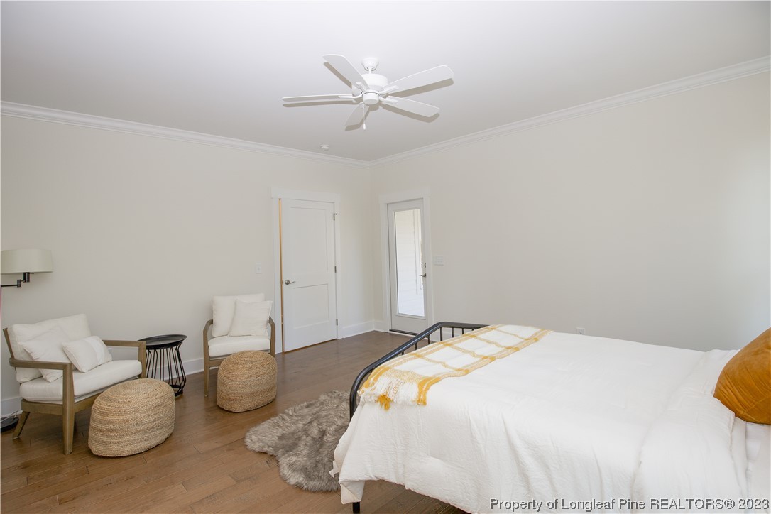 1365 McCaskill Road Carthage, NC 28327 - Photo 35 of 50 a bedroom with bed and a chandelier