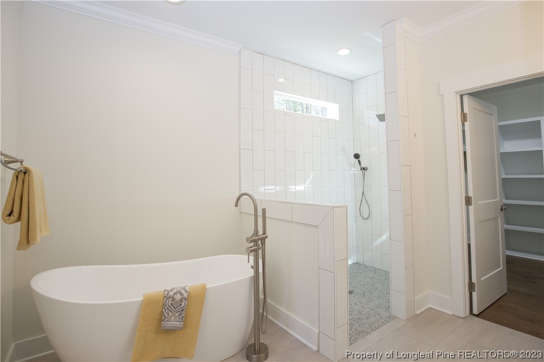 1365 McCaskill Road Carthage, NC 28327 - Photo 37 of 50 a bathroom with a white tub