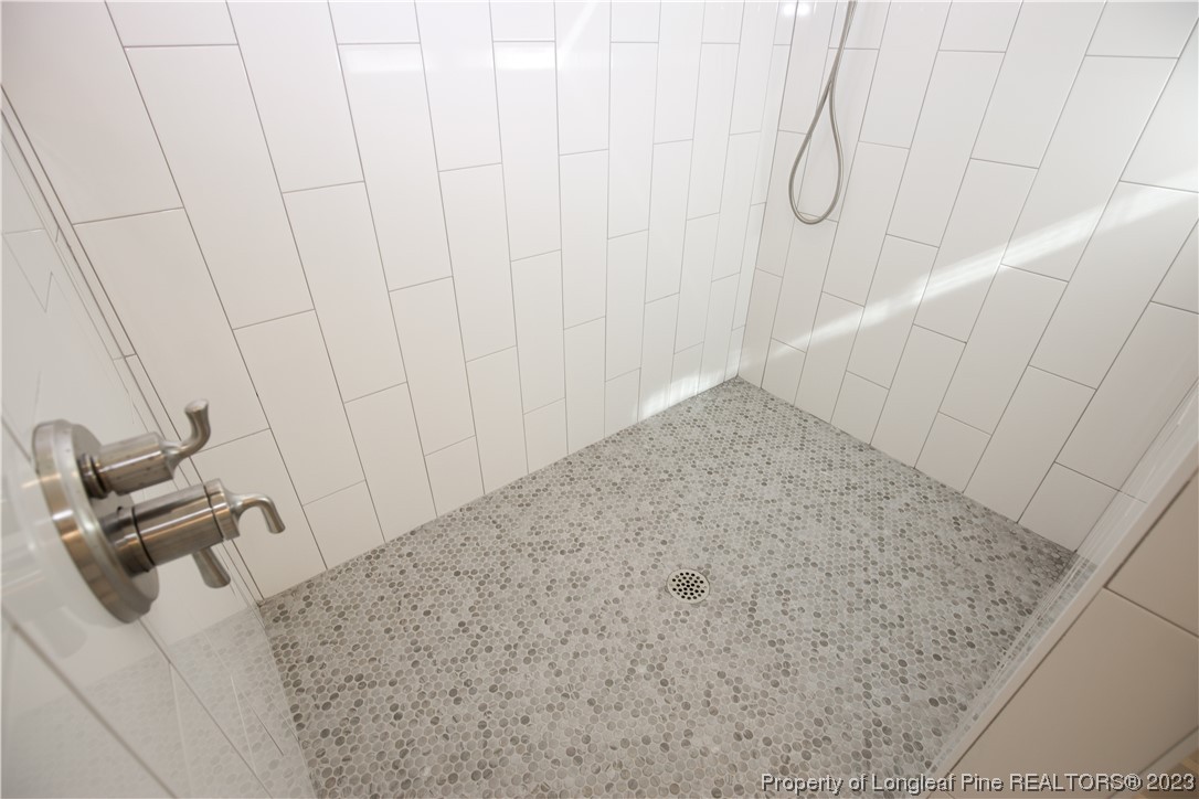1365 McCaskill Road Carthage, NC 28327 - Photo 40 of 50 a view of a room with racks on the wall