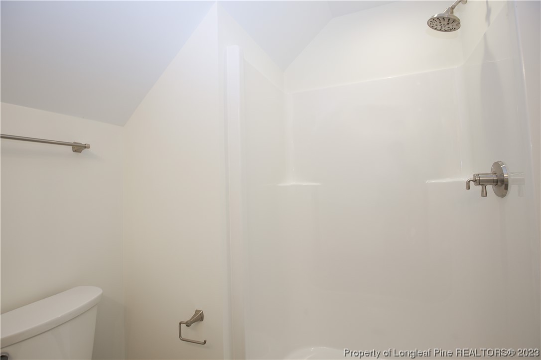 1365 McCaskill Road Carthage, NC 28327 - Photo 43 of 50 a bathroom with a white toilet and a shower