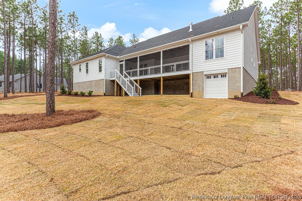 1365 McCaskill Road Carthage, NC 28327 - Photo 46 of 50 a view of a house with a backyard and balcony