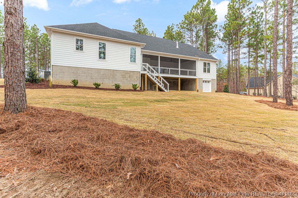 1365 McCaskill Road Carthage, NC 28327 - Photo 48 of 50 a view of a house with a yard and sitting area