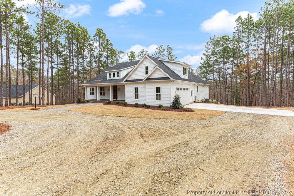 1365 McCaskill Road Carthage, NC 28327 - Photo 50 of 50 a front view of a house with a outdoor space