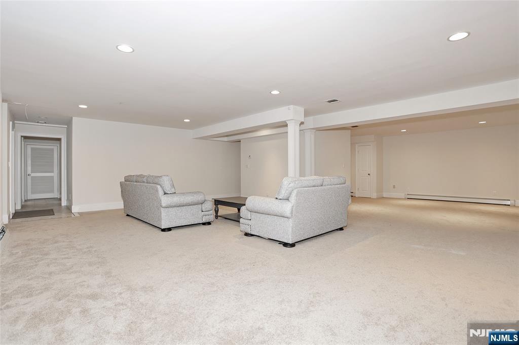 65 Ross Avenue Demarest, NJ 07627 - Photo 40 of 48 a living room with furniture and a couch
