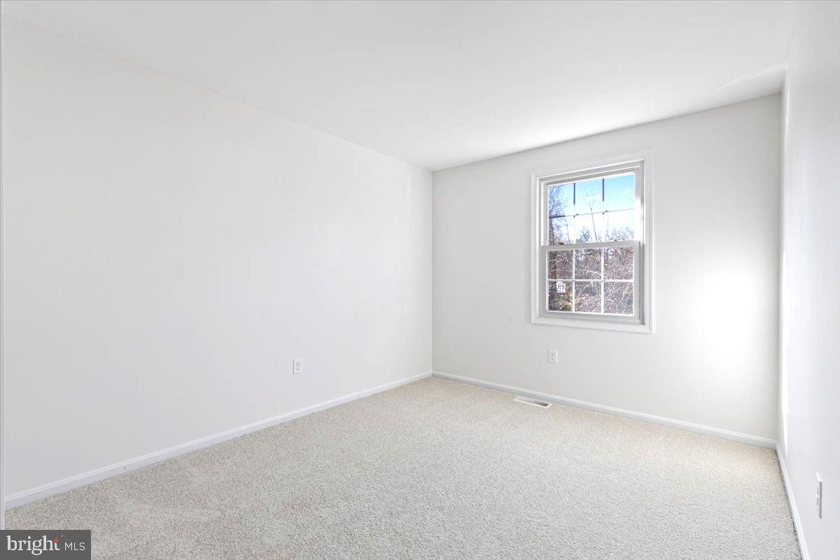 11654 Kipling Drive Waldorf, MD 20601 - Photo 13 of 33 an empty room with windows