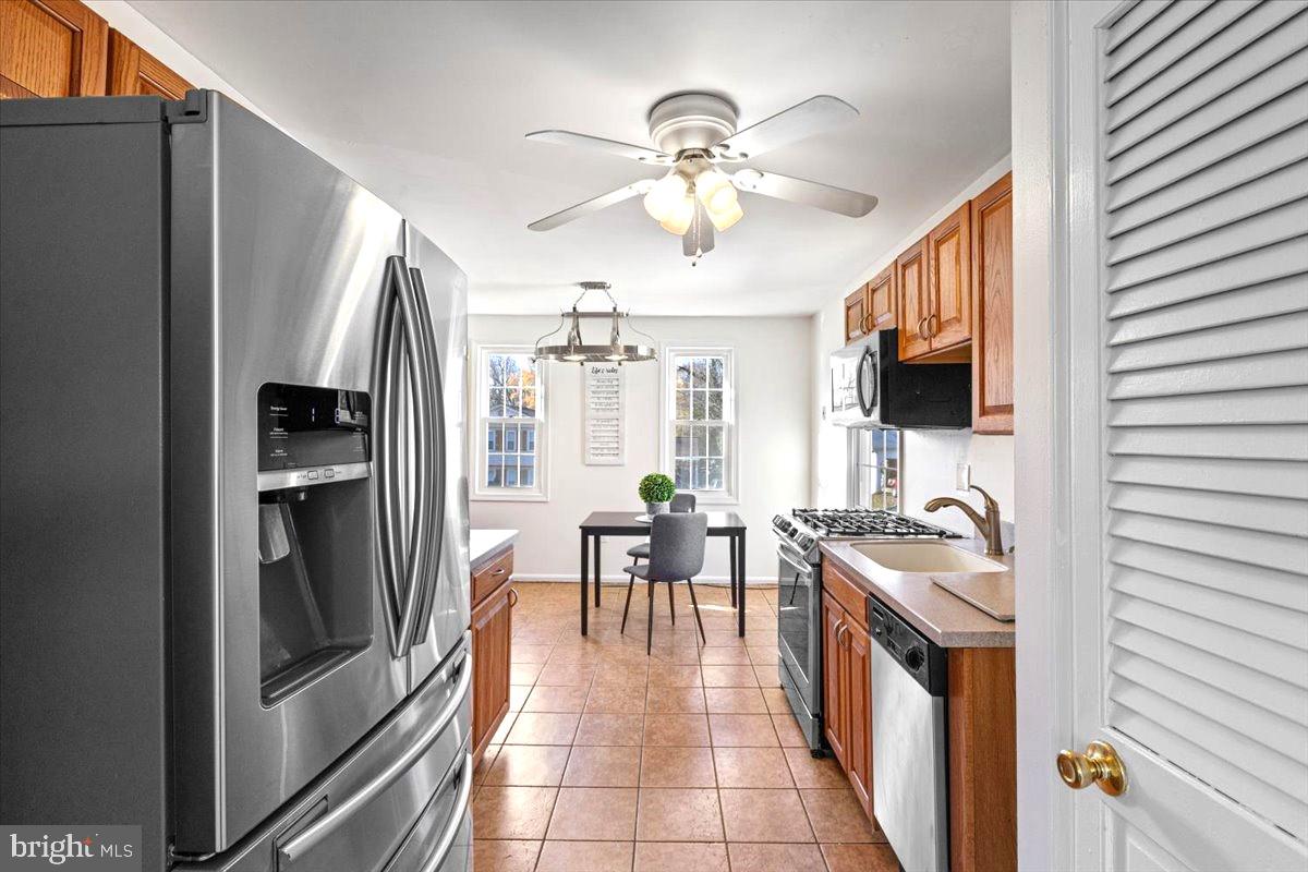 11654 Kipling Drive Waldorf, MD 20601 - Photo 7 of 33 a kitchen with stainless steel appliances granite countertop a refrigerator a stove and a sink