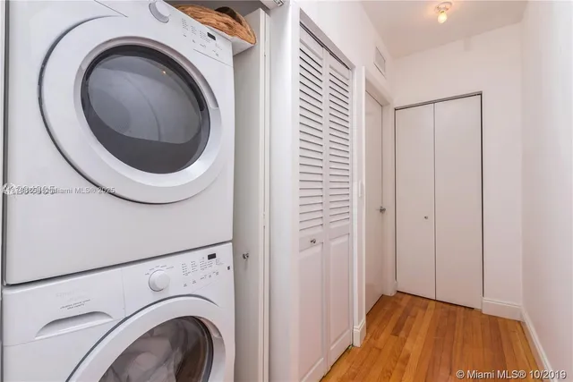 a view of a hallway with washer and dryer
