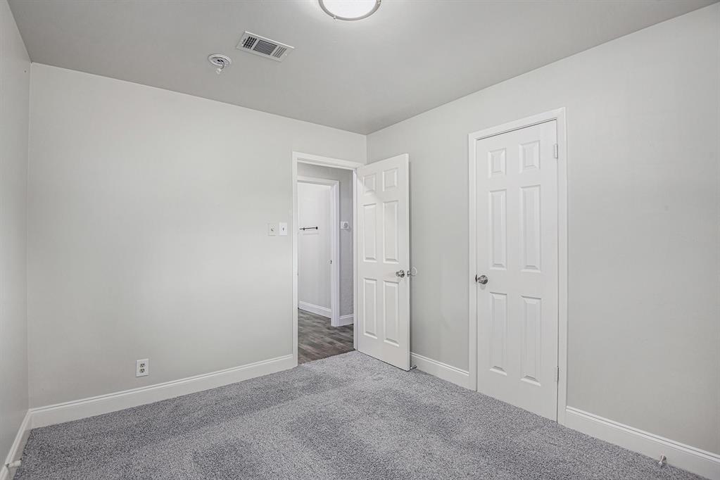 233 Victoria Avenue Azle, TX 76020 - Photo 12 of 25 Unfurnished bedroom featuring carpet and baseboards