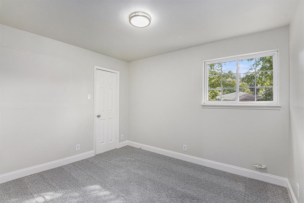 233 Victoria Avenue Azle, TX 76020 - Photo 15 of 25 Carpeted spare room with baseboards
