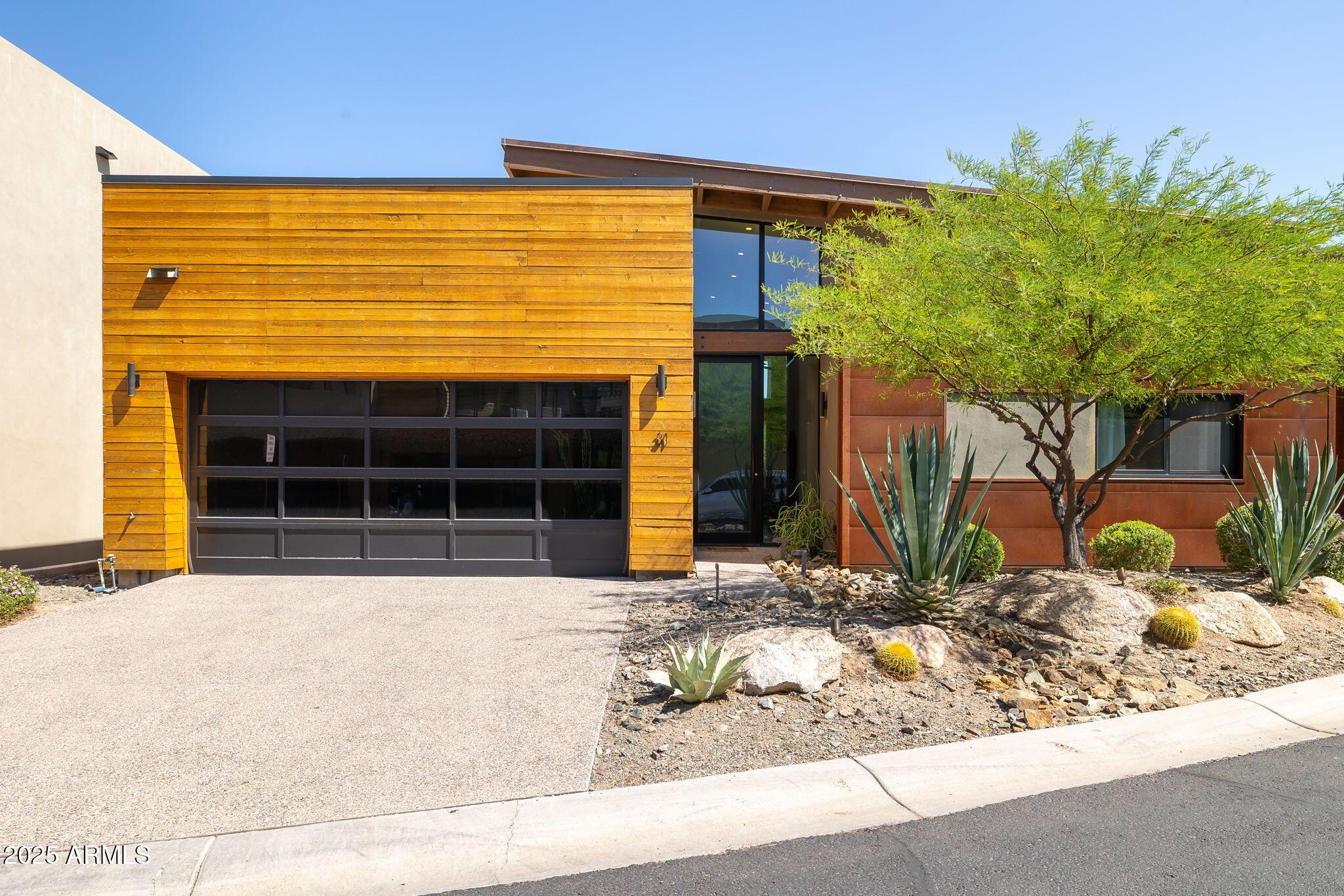 6525 East Cave Creek Road, Unit 31 Cave Creek, AZ 85331 - Photo 1 of 49 a front view of a house with a yard