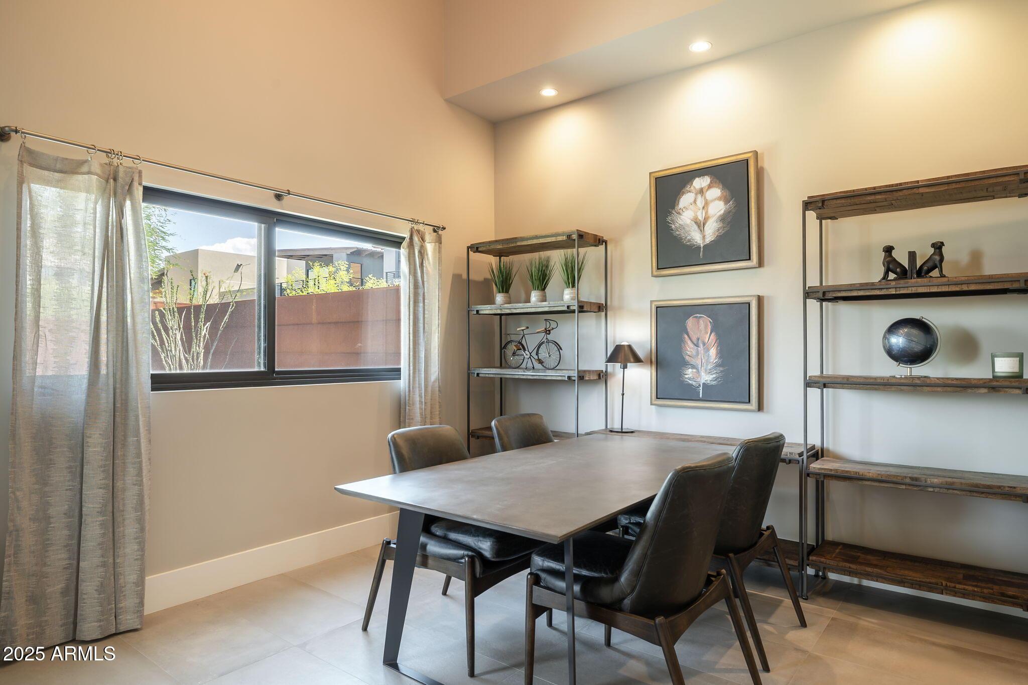 6525 East Cave Creek Road, Unit 31 Cave Creek, AZ 85331 - Photo 17 of 49 a view of a dining room with furniture and a window