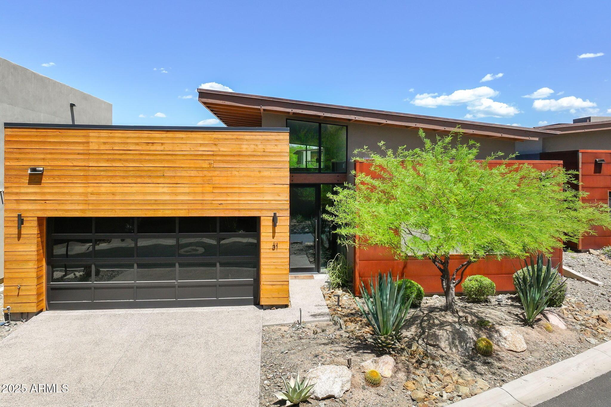 6525 East Cave Creek Road, Unit 31 Cave Creek, AZ 85331 - Photo 2 of 49 a front view of a house with a yard