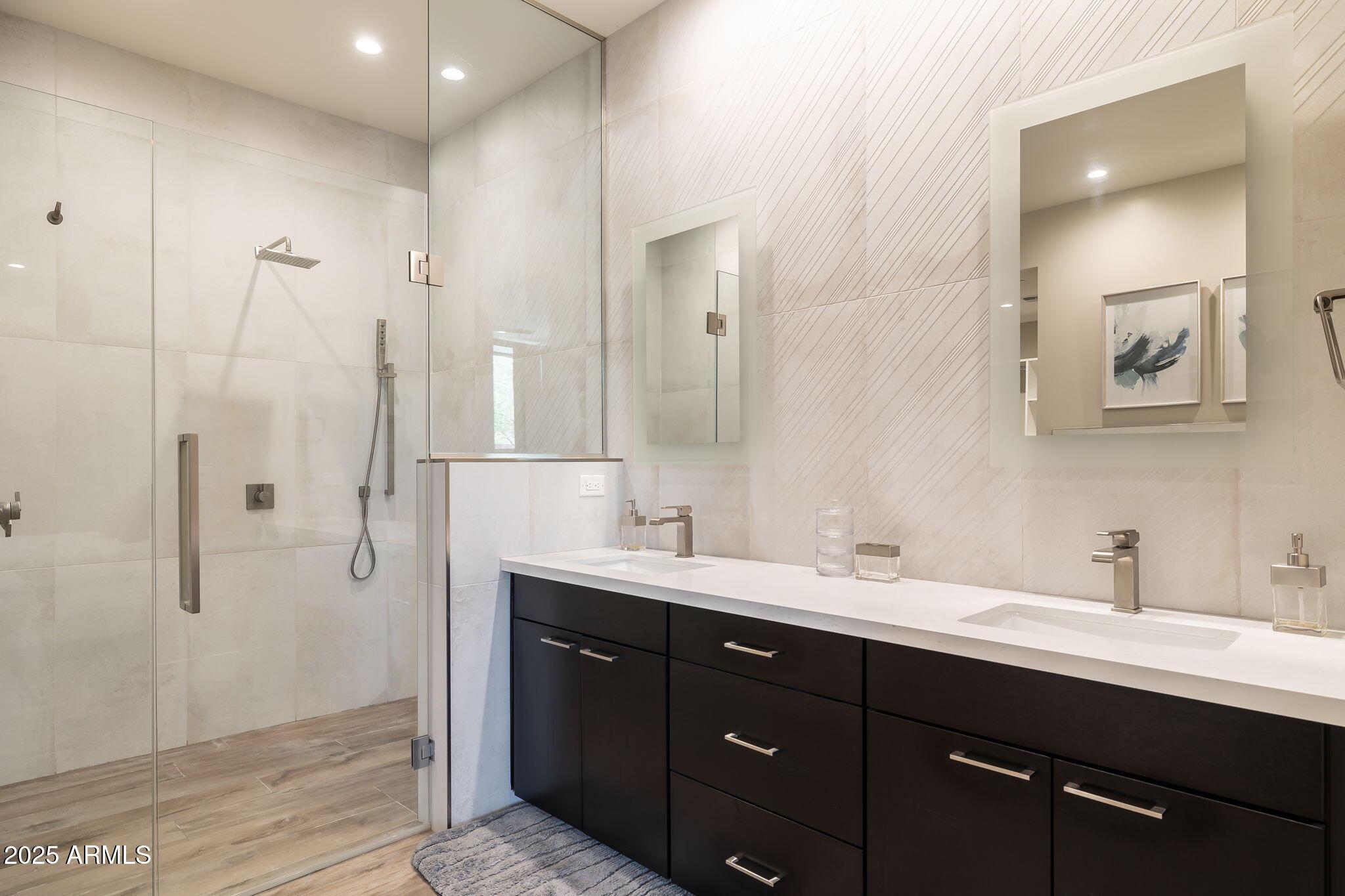 6525 East Cave Creek Road, Unit 31 Cave Creek, AZ 85331 - Photo 23 of 49 a bathroom with a double vanity sink mirror and double