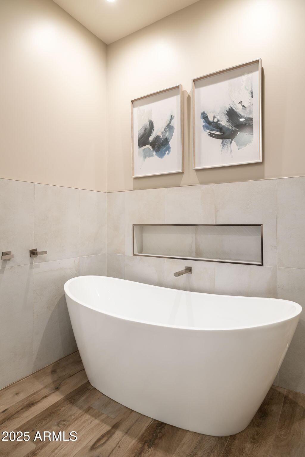 6525 East Cave Creek Road, Unit 31 Cave Creek, AZ 85331 - Photo 26 of 49 a white tub sitting next to a white wall
