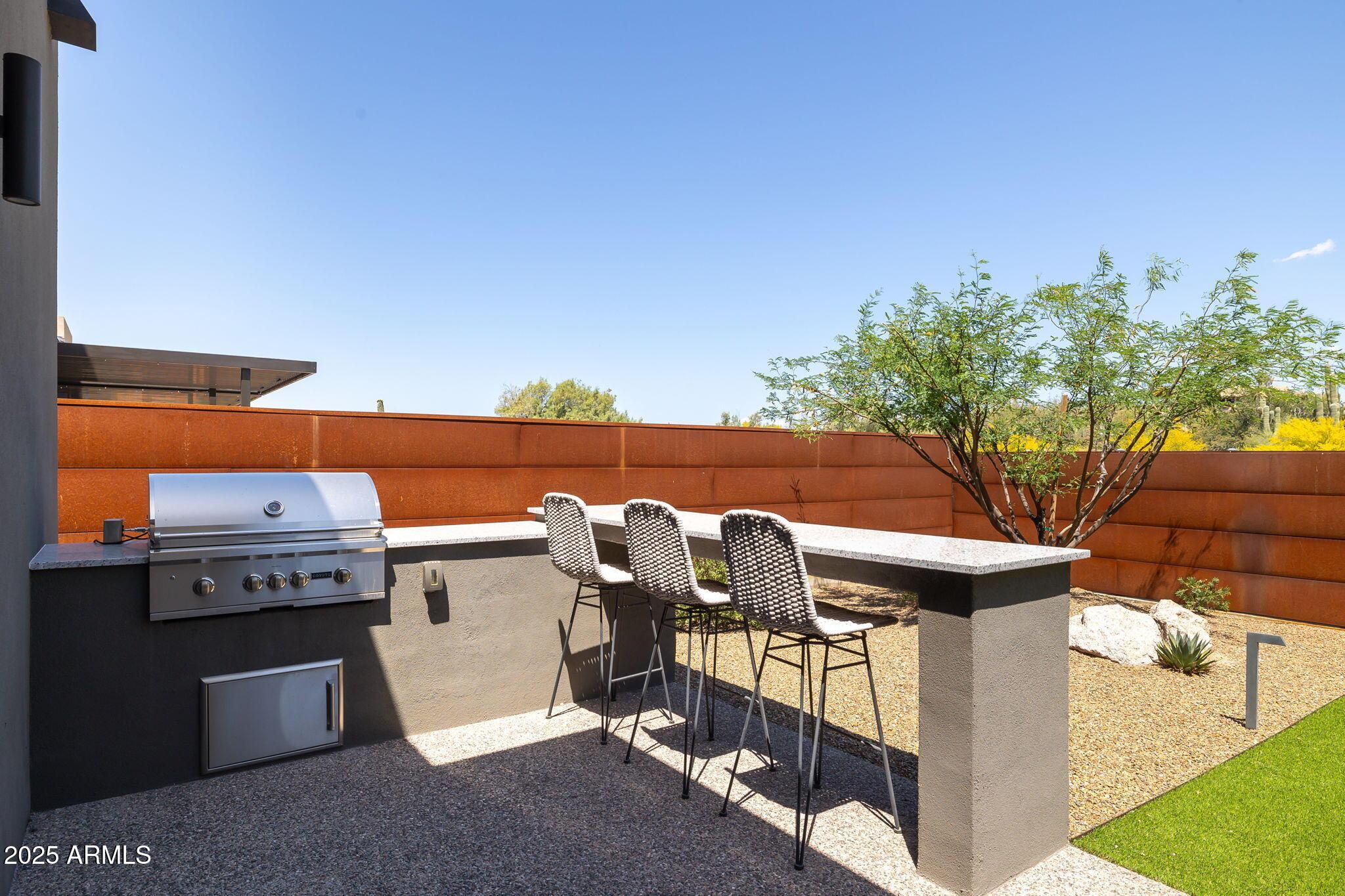 6525 East Cave Creek Road, Unit 31 Cave Creek, AZ 85331 - Photo 44 of 49 a view of a patio with iron fence