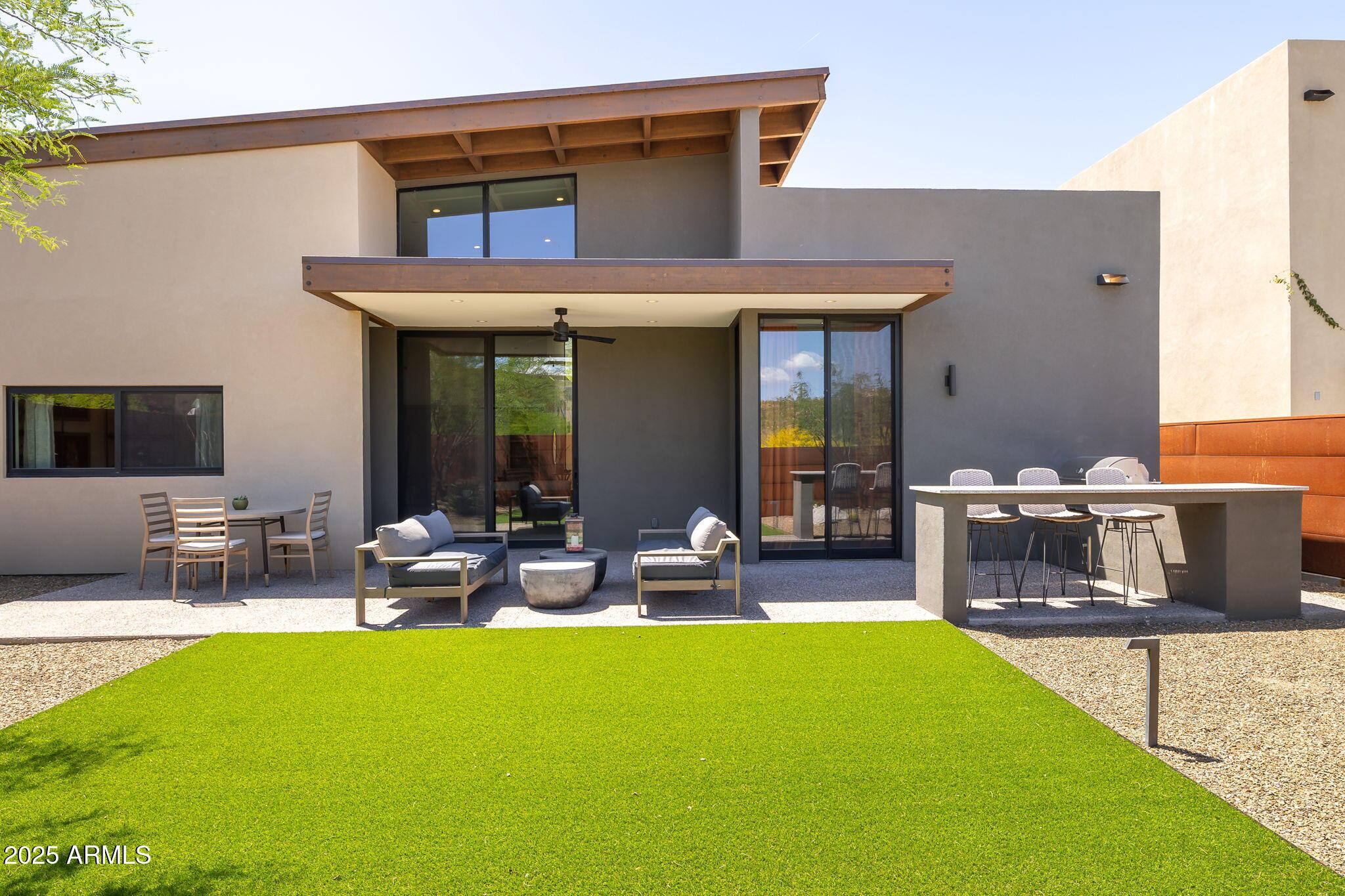 6525 East Cave Creek Road, Unit 31 Cave Creek, AZ 85331 - Photo 45 of 49 a view of a house with swimming pool and sitting area